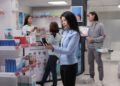 elderly client looking at bottles of pills to buy 2023 11 27 05 10 37 utc scaled